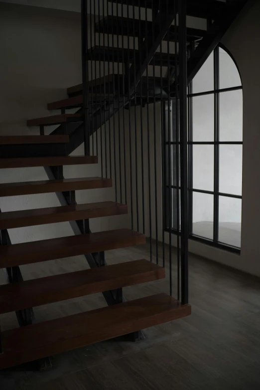 the stairway is made of metal and wooden