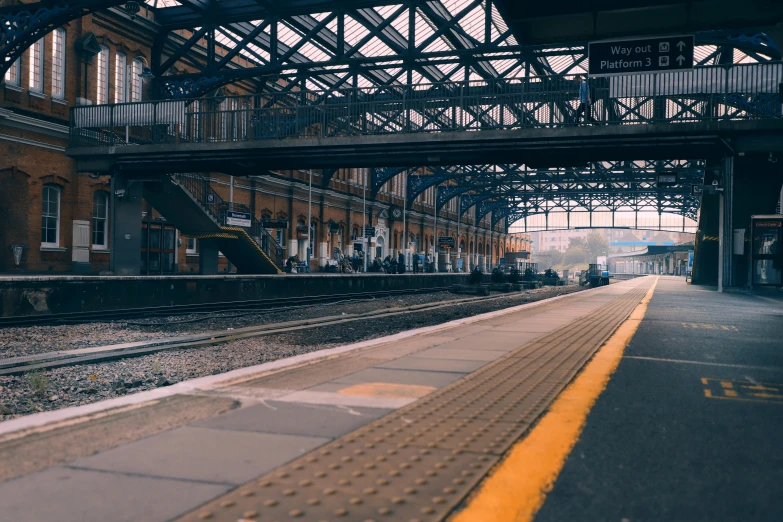 there is an empty train station with the railroad platform