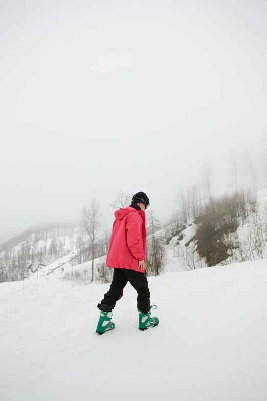 a man riding skis on top of a snow covered slope