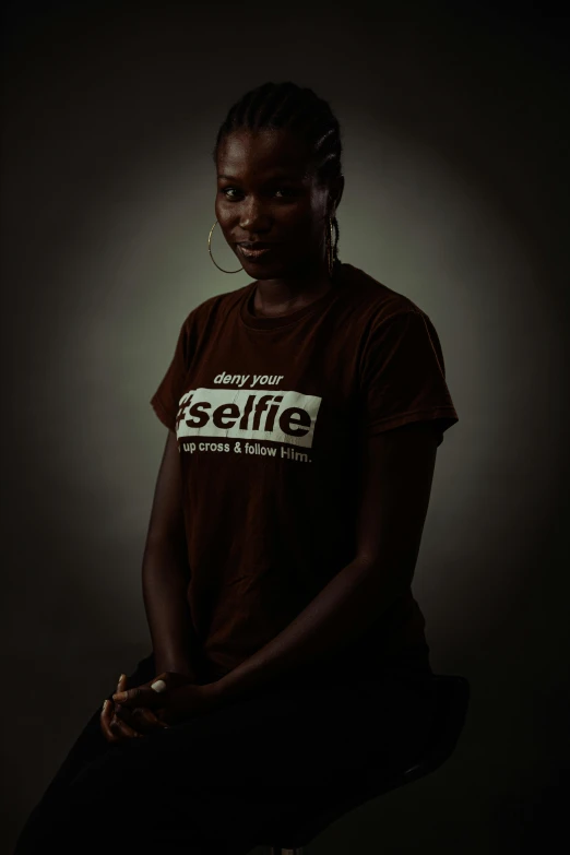 woman sitting down on her legs in the dark