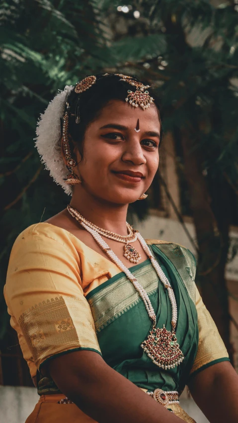 an indian woman wearing a traditional garb and jewelry