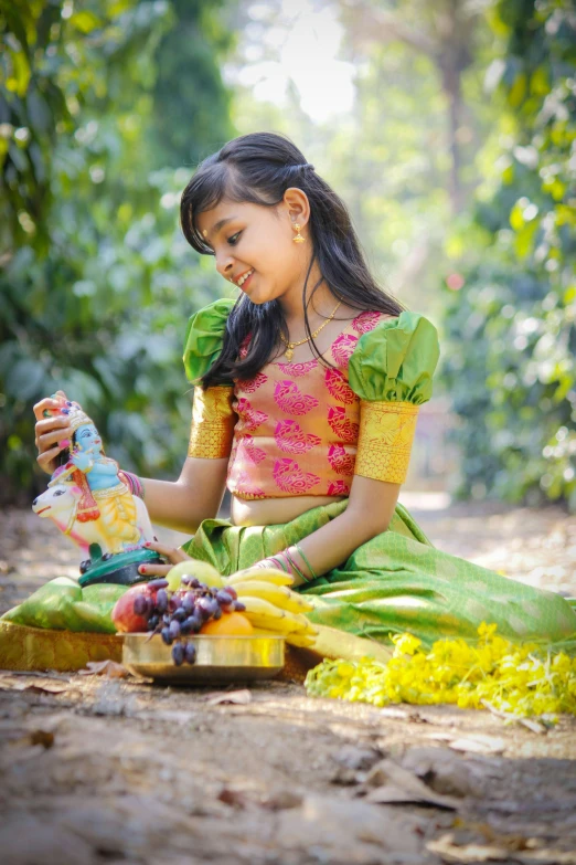 the  is enjoying her fruit in her hand