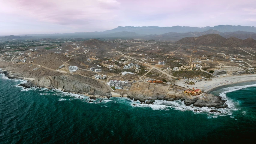 an aerial view of the coastline and town