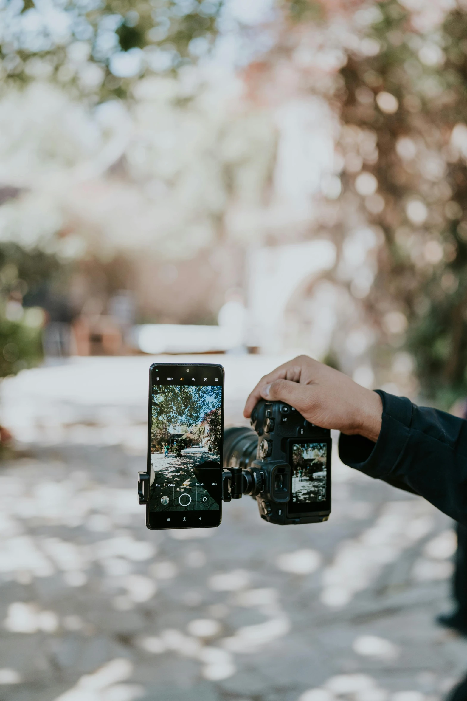 a person is holding a camera up for the camera