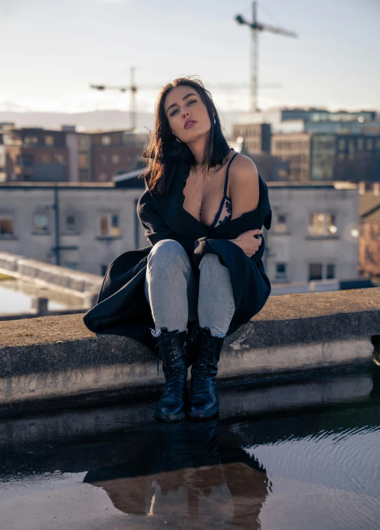 an image of a woman sitting outside wearing boots