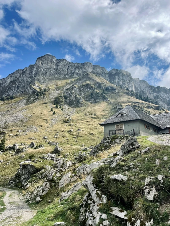 an image of a house on the side of a mountain