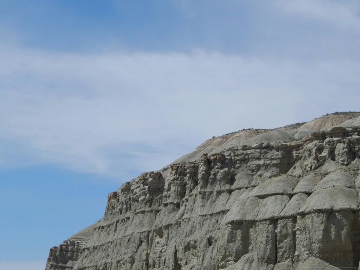 a large mountain with many interesting formations growing on it