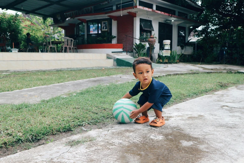 a  on the cement with a soccer ball