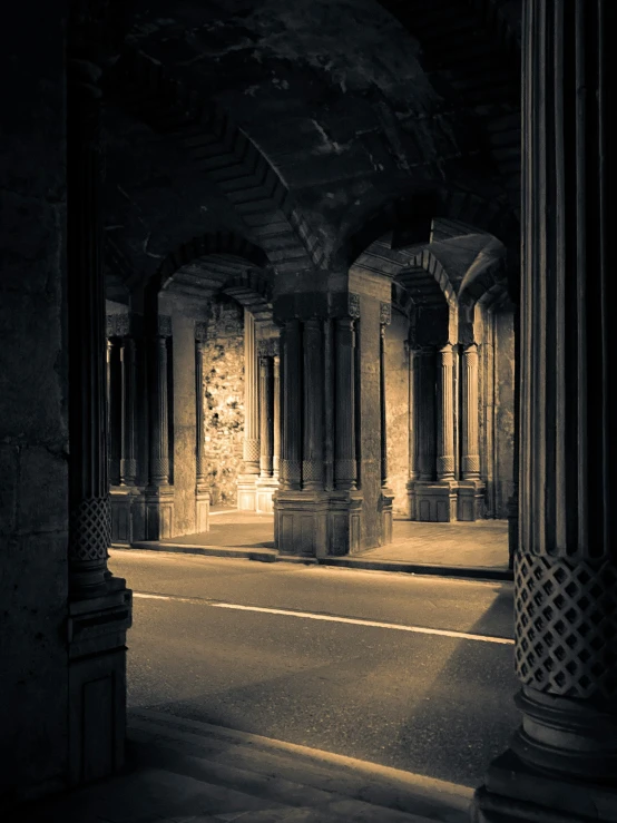 a long passageway that is covered by columns and pillars