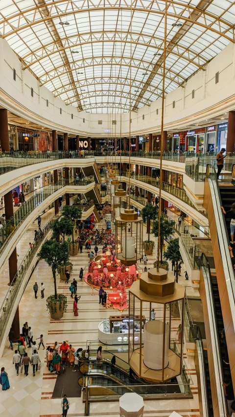 a city shopping mall with many shops and several people