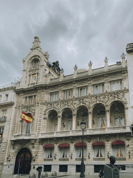 a very tall fancy looking building with columns and windows