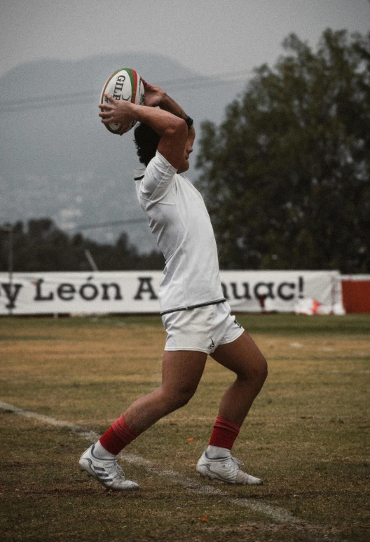 a man holding a ball in front of him