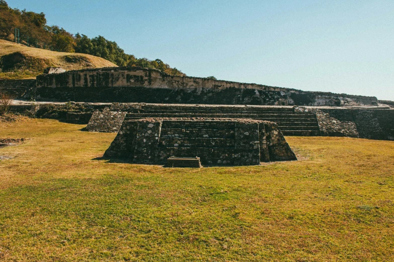 several old buildings are in a field