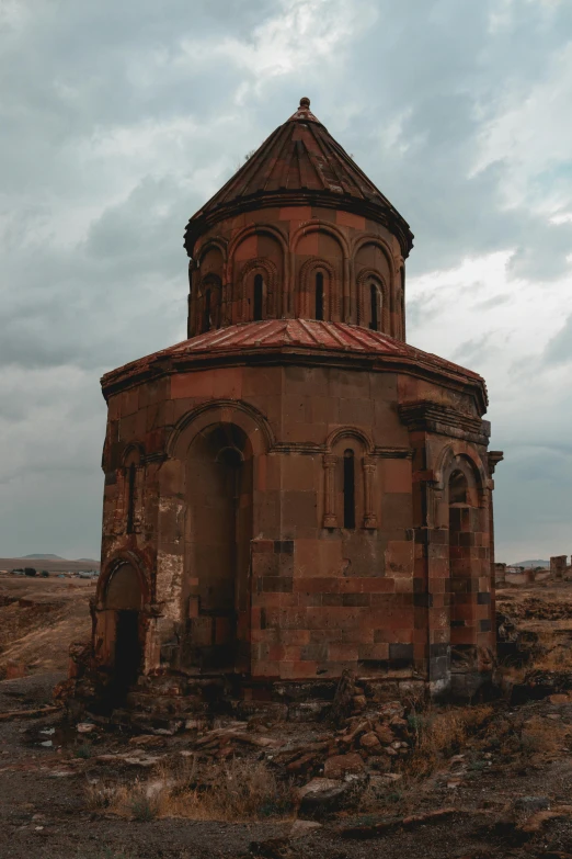 an old rusty building with a steeple and window on the roof