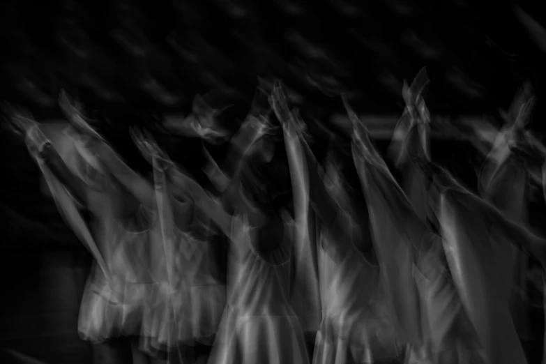 a group of dancers are all blurry from motion