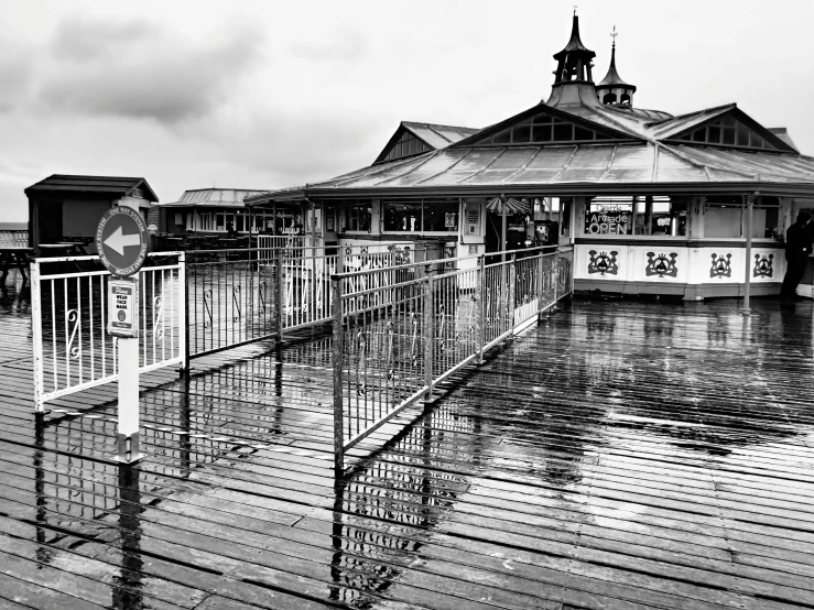 two people are standing at the terminal looking