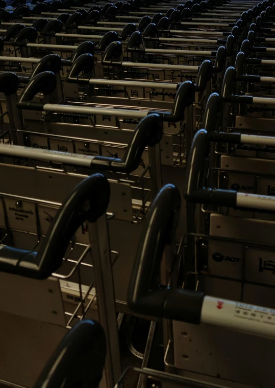 rows of metal seats with arms resting next to each other