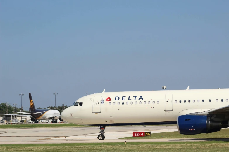 a big jet airplane on the ground at an airport