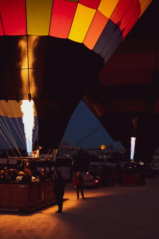 a man in red is looking inside of a  air balloon