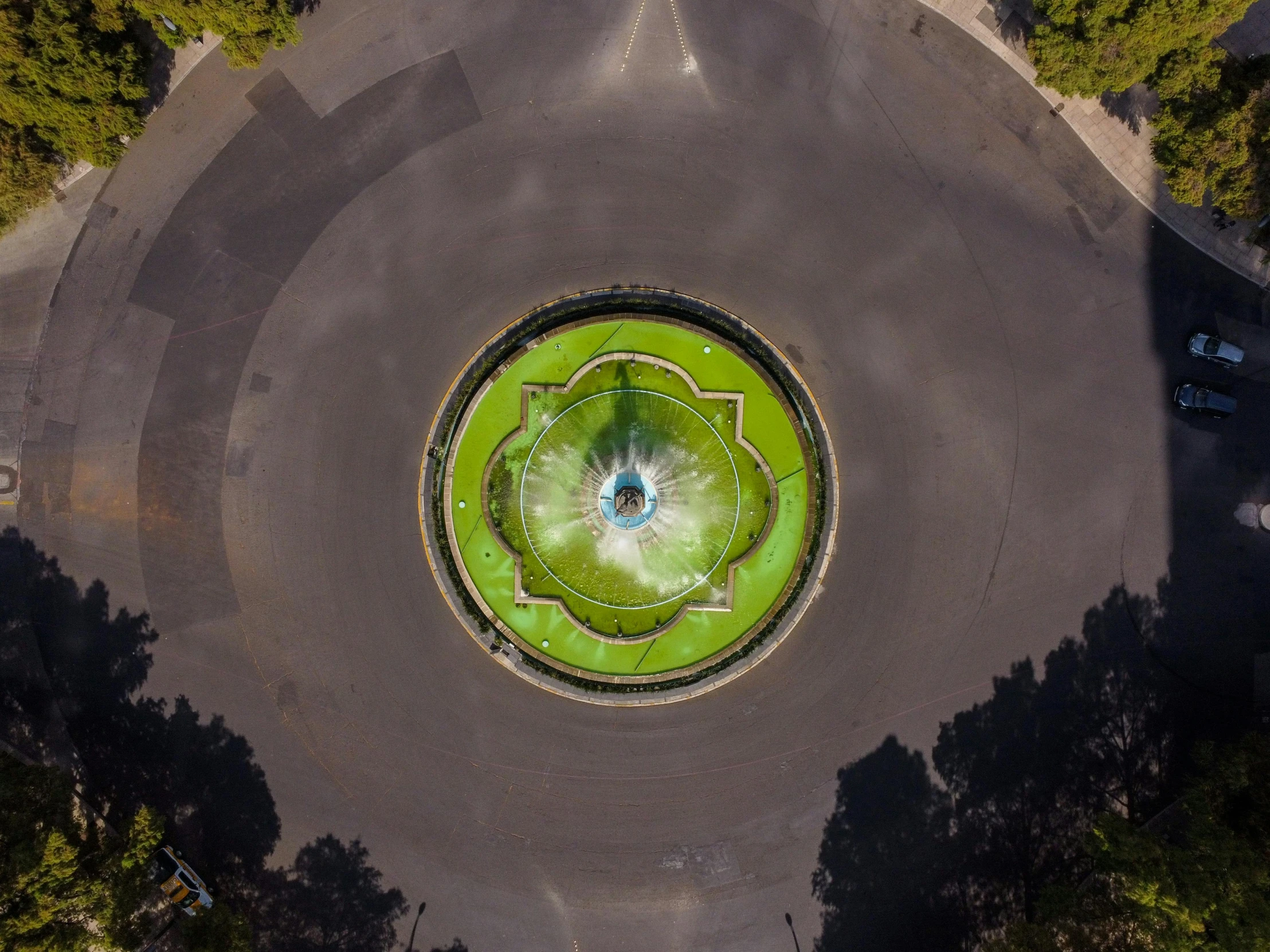 an overhead s of a park with green trees