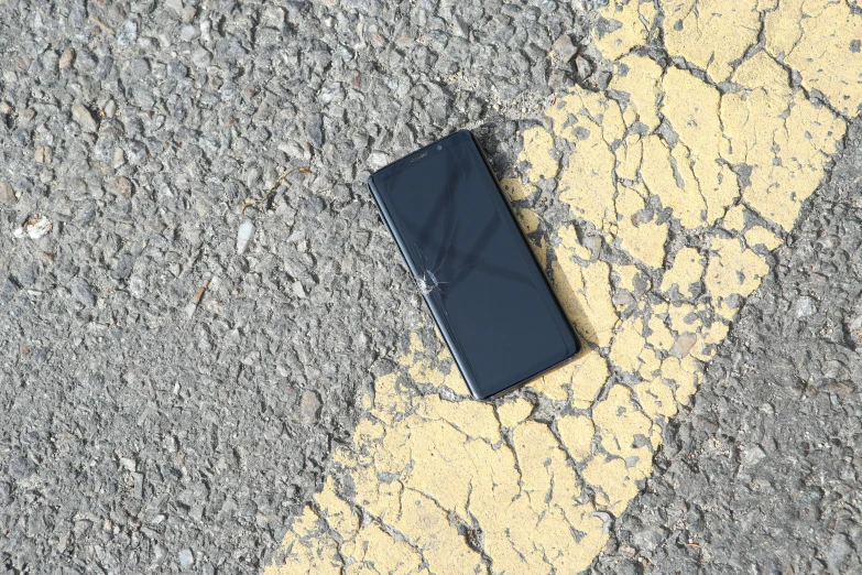 the phone is on its side on the street