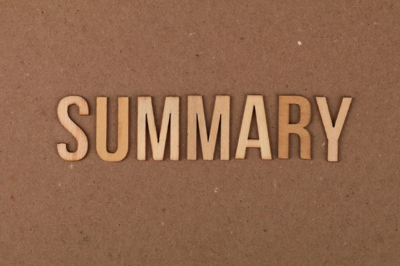 wooden words and some brown background saying that says'summary '