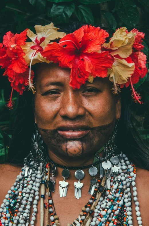 native woman with flower crown and bea necklace