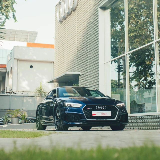 a car parked on a street in front of a building