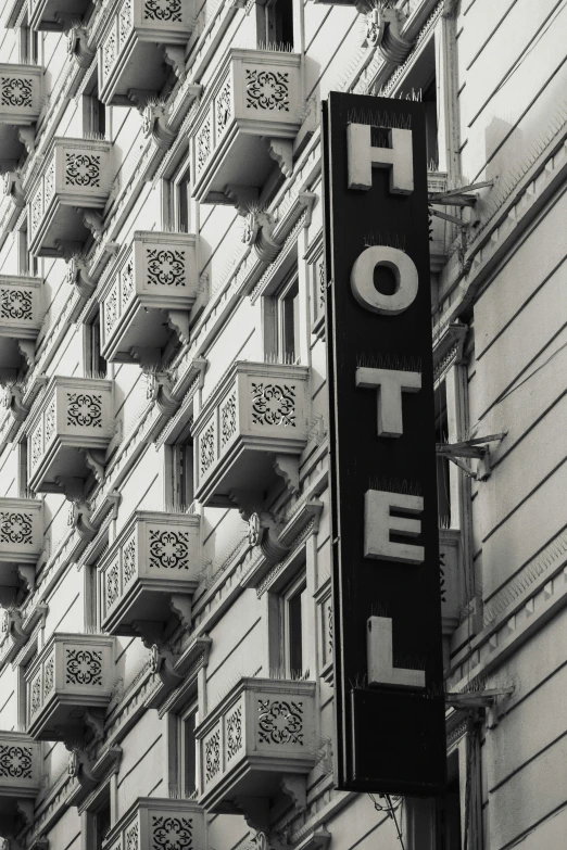 there are balconies and a sign on the side of the building