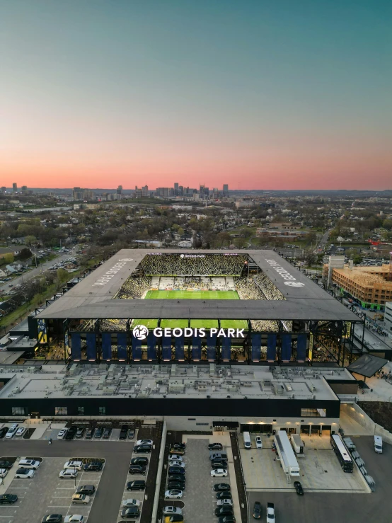 an overhead view of a stadium and parking lot