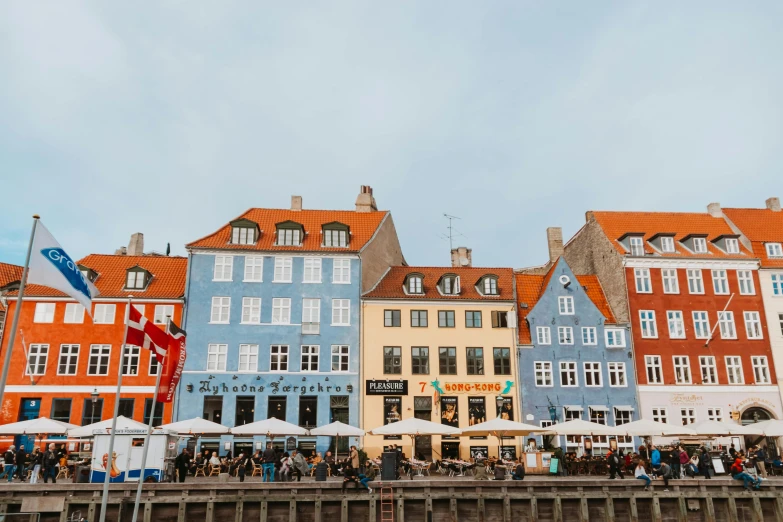 a row of houses with umbrellas in the city