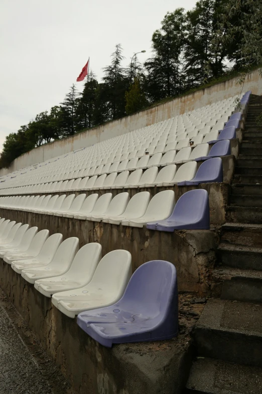 many empty seats at the stadium on a nice day