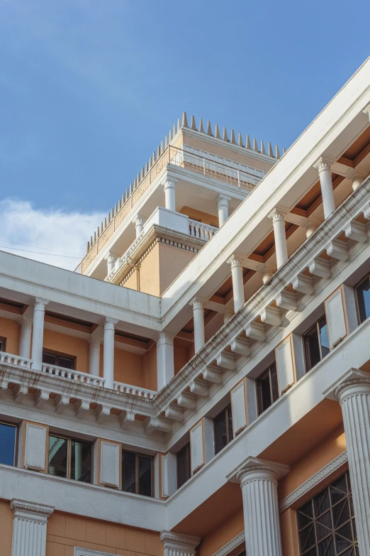 a tall building with three stories below and some windows