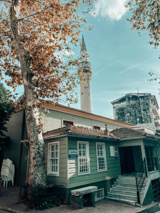 an old house is shown with an old tower