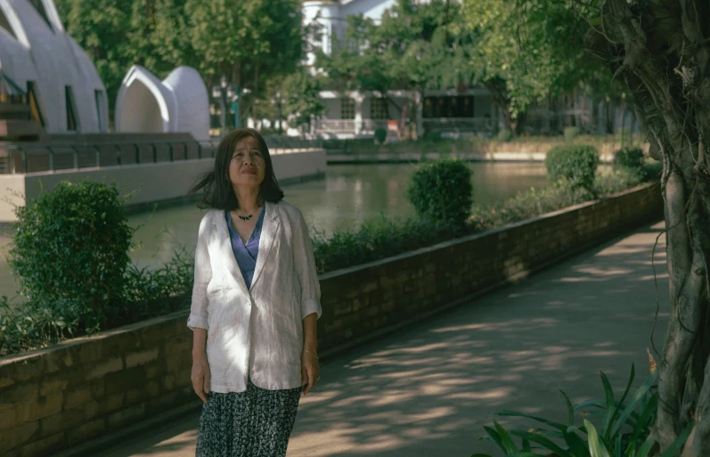 an old woman walking with her eyes closed