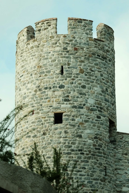 a large brick tower with a window in it