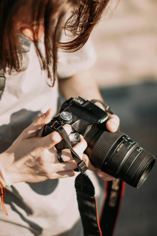 someone taking pictures with their camera while holding a cup