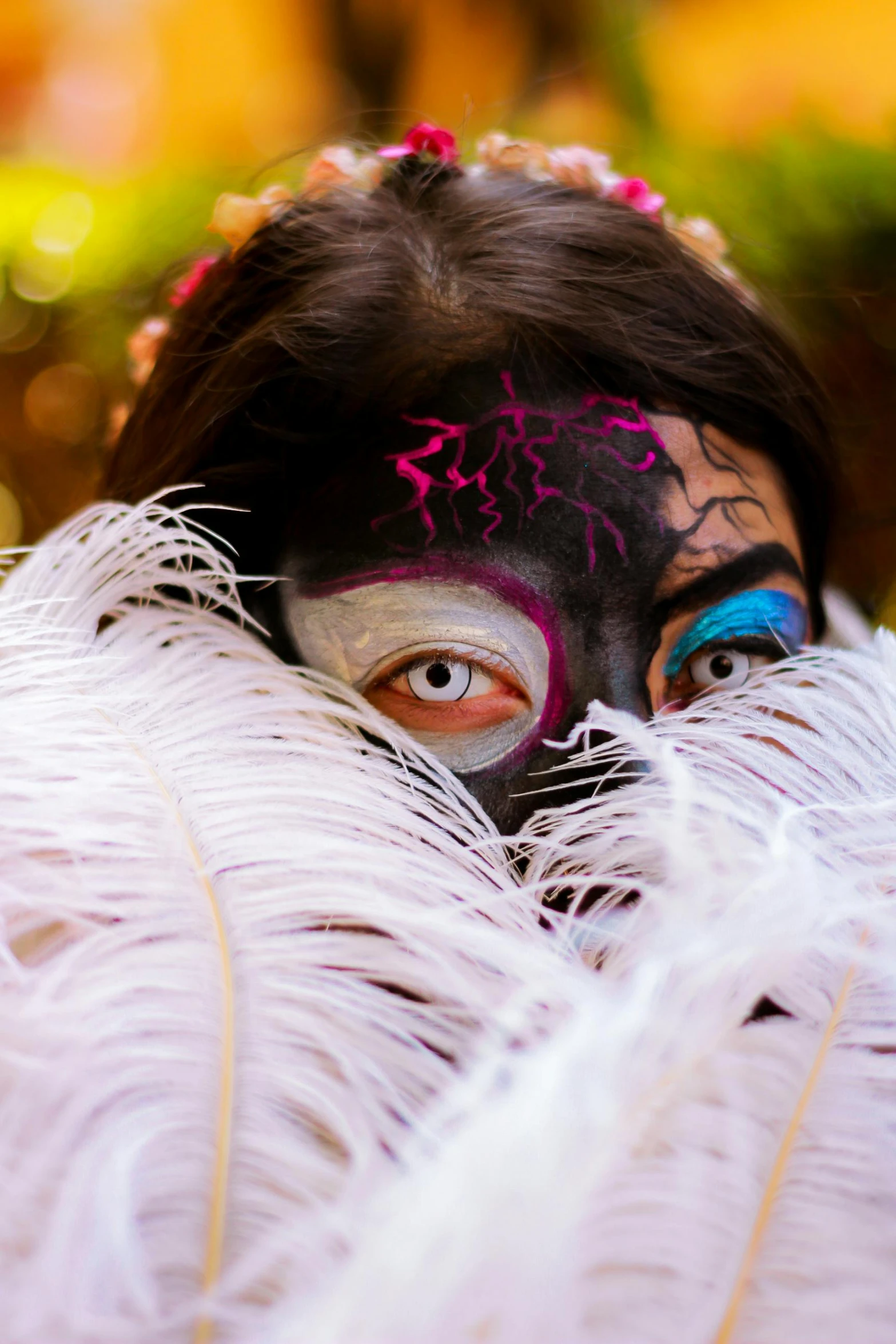 an asian woman with face paint on her face