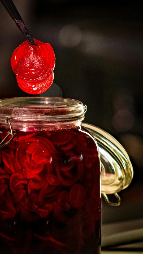 a jar filled with liquid sitting on top of a table