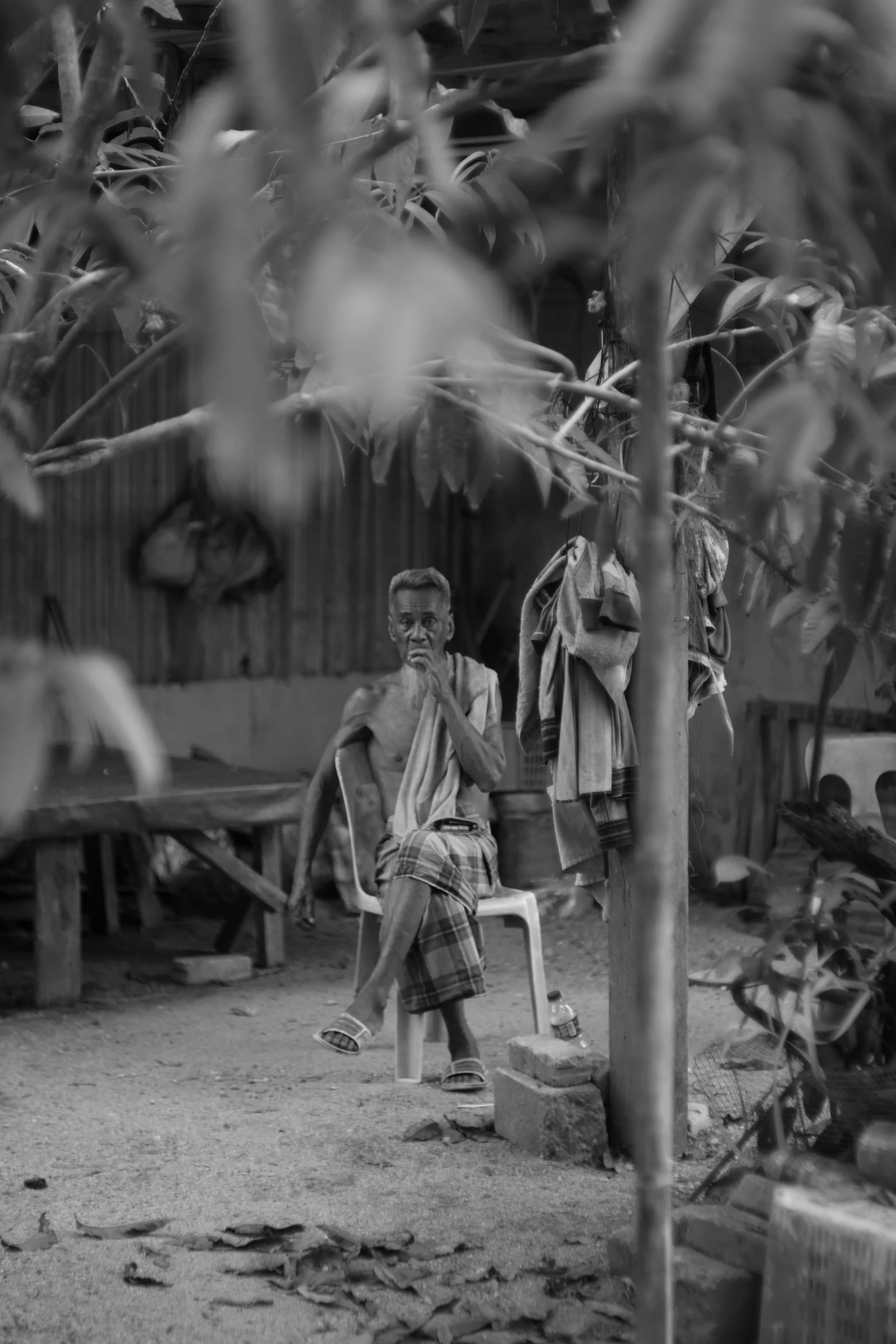 a black and white po shows men with shorts hanging