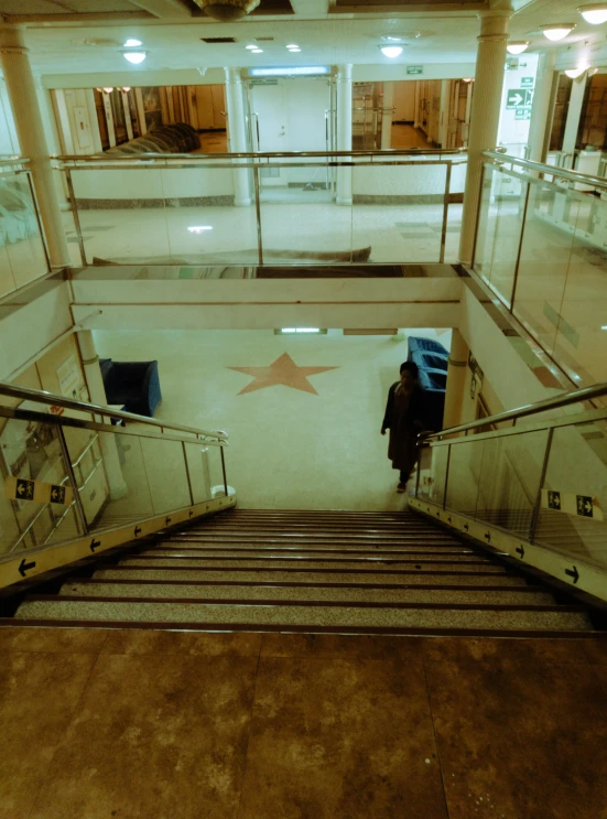 a man walking up stairs in a building