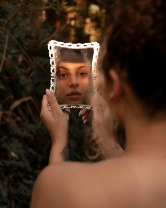 a woman in the mirror with a mirror on her face and a head