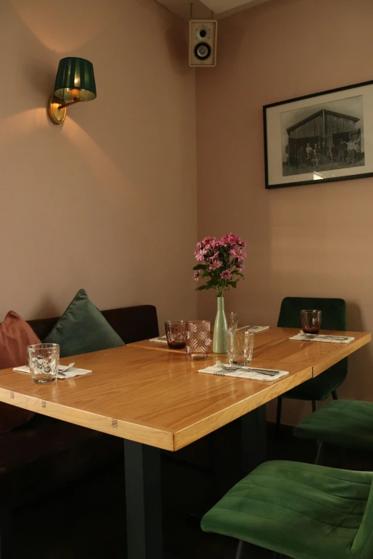 a small table with chairs and table setting