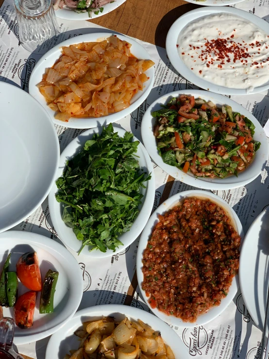 a table filled with plates of food on it