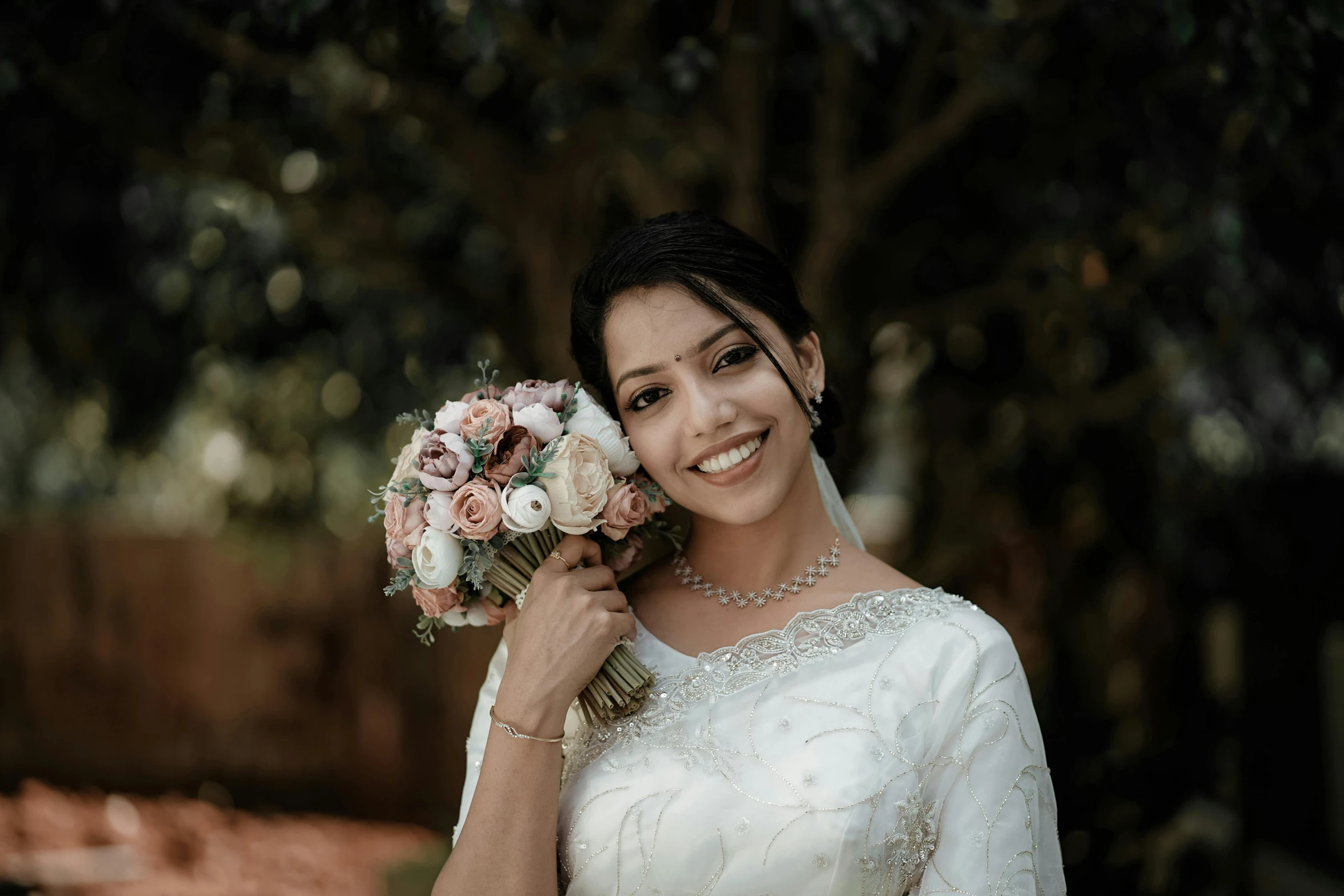 a woman with flowers in her hand poses for a po