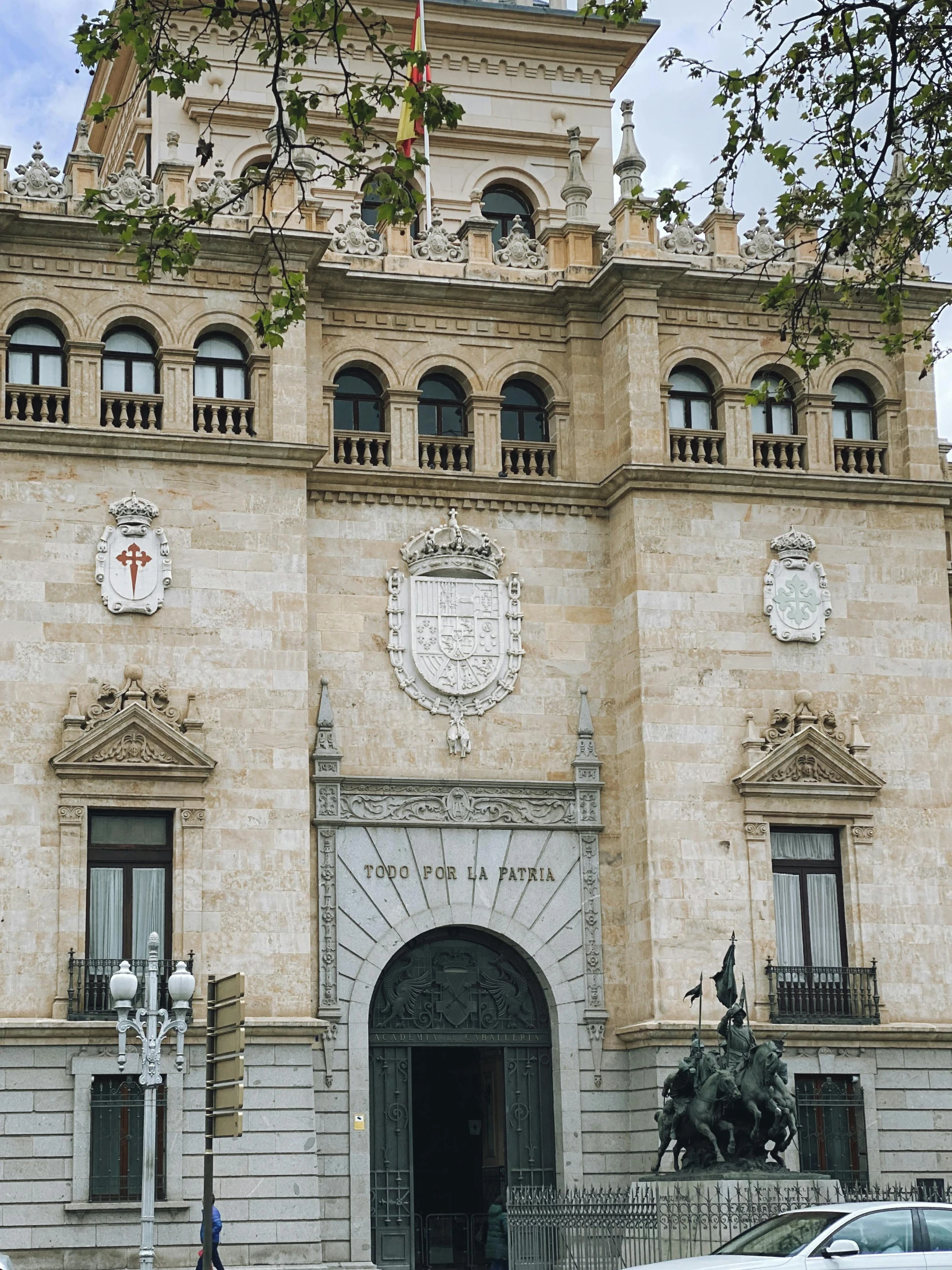 an ornate building with a clock tower sits in the middle of a city