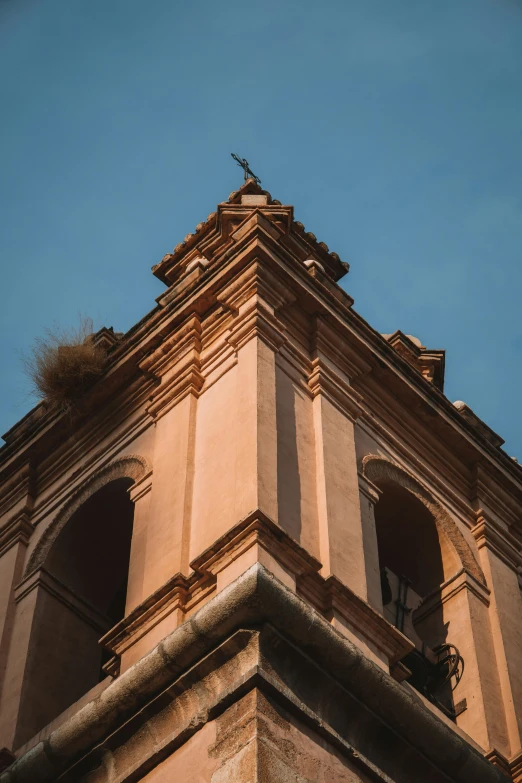 a tall clock tower with clocks on the side of it