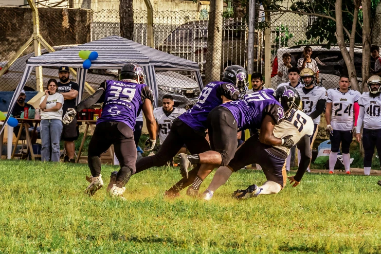 a football game is being played on grass