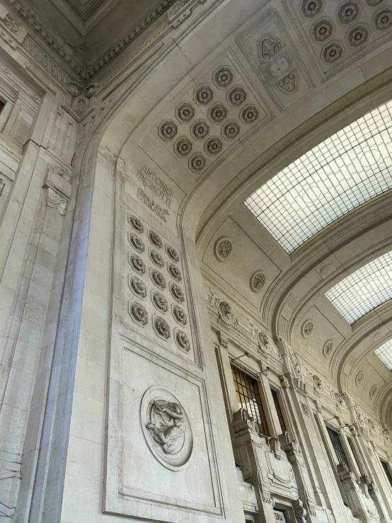 the columns in the foyer are covered with white marble