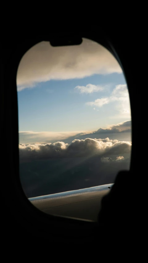 the view of some clouds taken through an airplane window